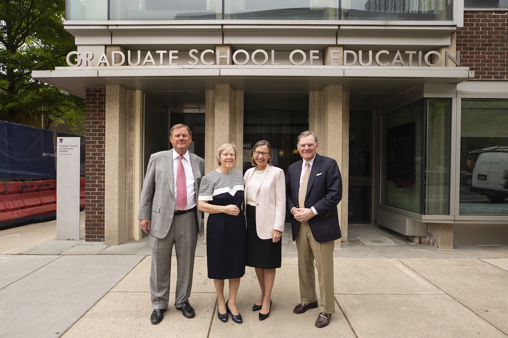 McGraw Family posing with Penn GSE Dean Pam Grossman in front of the Penn GSE building