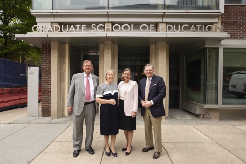 McGraw Family posing with Penn GSE Dean Pam Grossman in front of the Penn GSE building
